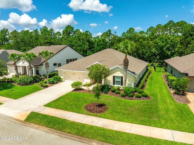 665 Elk River Dr, Ormond Beach, FL 32174 - view of front facade with a garage and a front yard