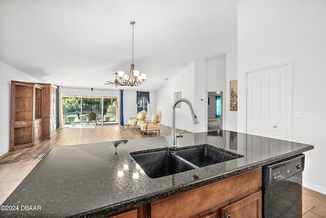 665 Elk River Dr, Ormond Beach, FL 32174 - kitchen with vaulted ceiling, black dishwasher, hanging light fixtures, sink, and dark stone countertops