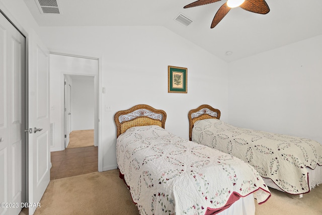 665 Elk River Dr, Ormond Beach, FL 32174 - bedroom featuring a closet, carpet, vaulted ceiling, and ceiling fan