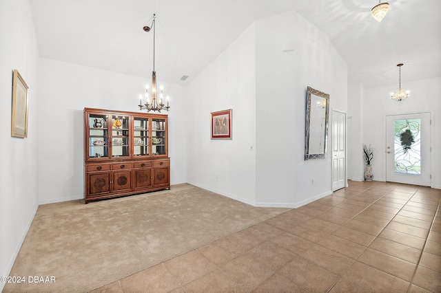 665 Elk River Dr, Ormond Beach, FL 32174 - interior space featuring high vaulted ceiling and a notable chandelier