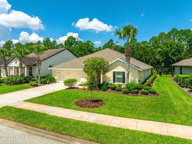 665 Elk River Dr, Ormond Beach, FL 32174 - view of front facade with a garage and a front yard