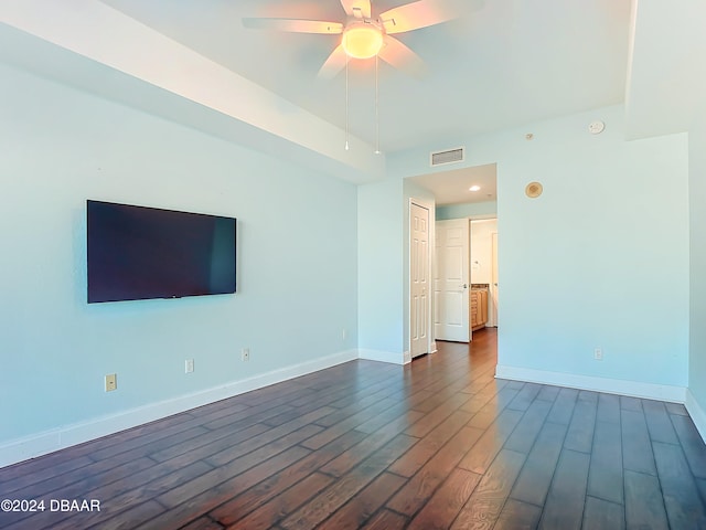 unfurnished room featuring ceiling fan and dark hardwood / wood-style flooring