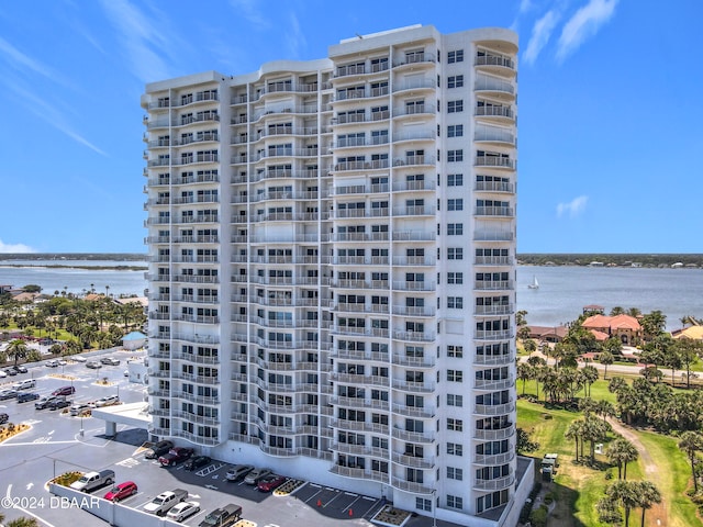 view of building exterior with a water view