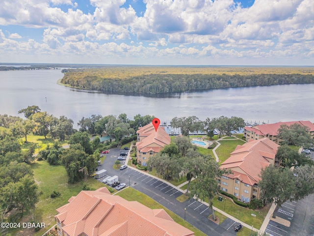 birds eye view of property with a water view