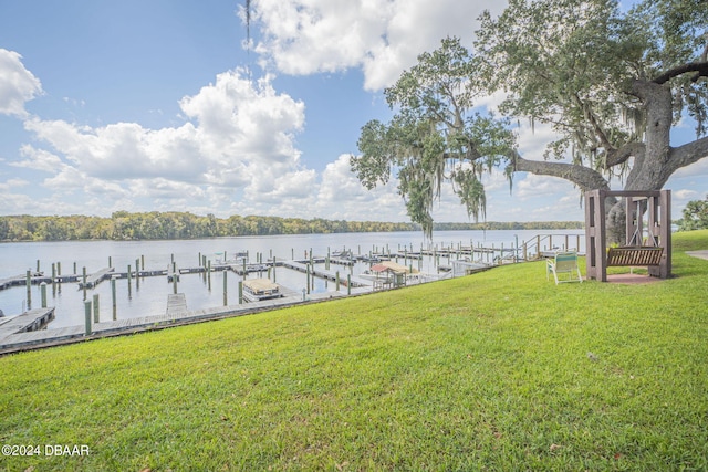 dock area featuring a yard and a water view