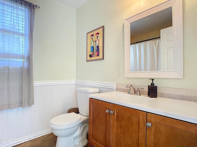 bathroom featuring vanity and toilet