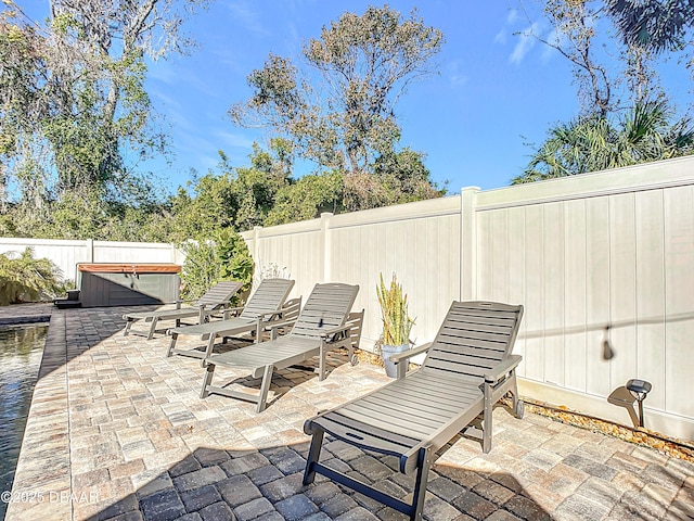 view of patio featuring a hot tub