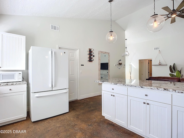 kitchen with white cabinetry, lofted ceiling, pendant lighting, and white appliances