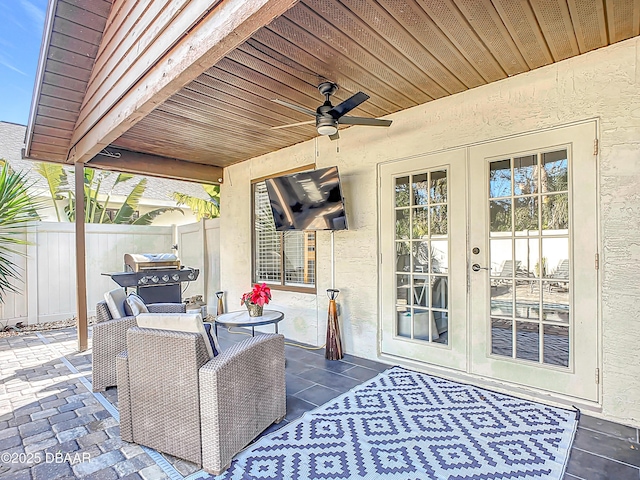 view of patio with french doors and ceiling fan