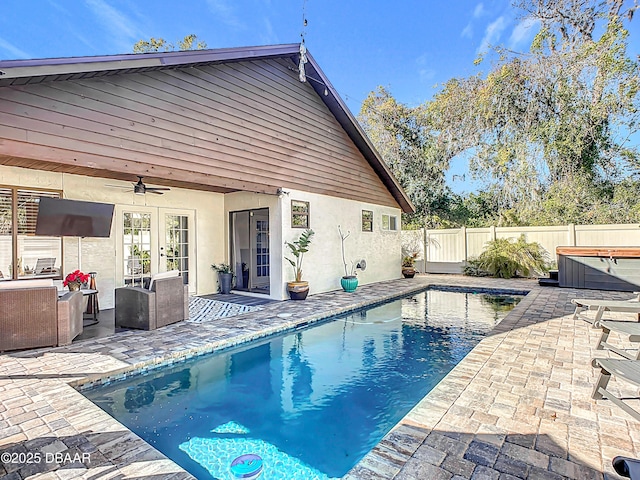 view of swimming pool featuring a patio area, a hot tub, and ceiling fan