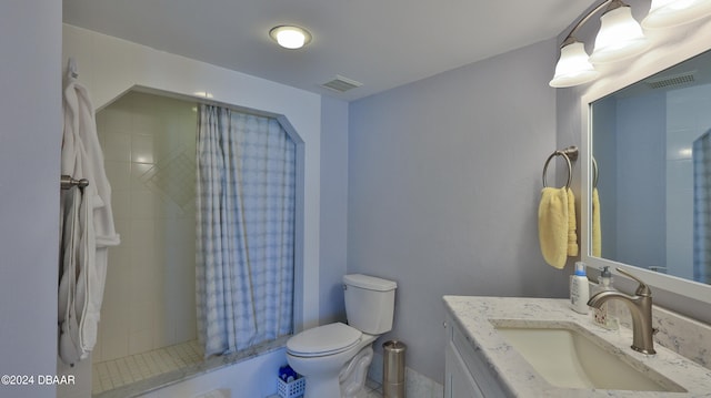 bathroom with vanity, toilet, and a shower with curtain