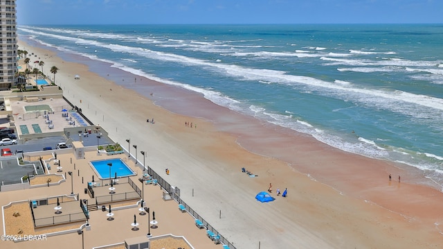 birds eye view of property featuring a view of the beach and a water view