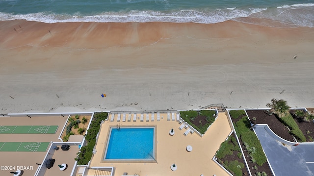 bird's eye view with a beach view and a water view