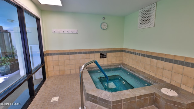 view of swimming pool featuring an indoor in ground hot tub