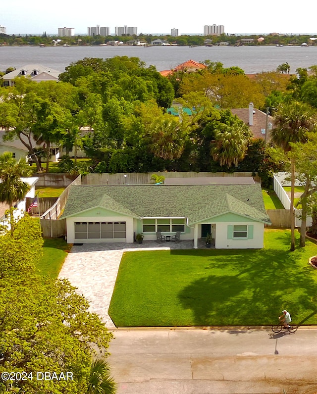 birds eye view of property with a water view