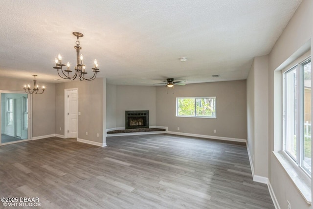 unfurnished living room with hardwood / wood-style floors and plenty of natural light