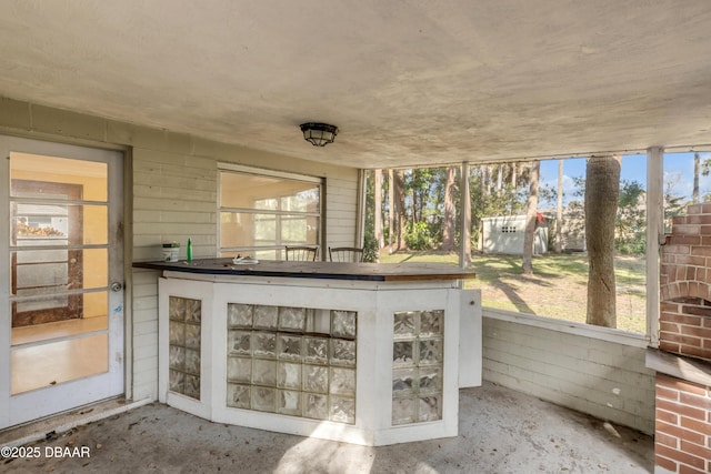 unfurnished sunroom featuring a healthy amount of sunlight