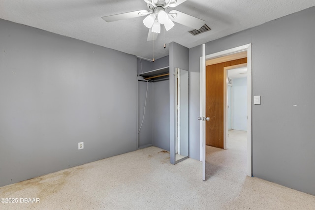 bedroom with ceiling fan, a closet, and a textured ceiling