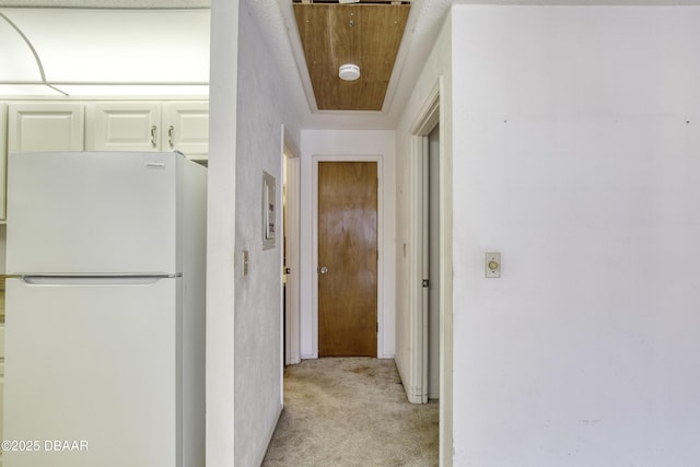 hallway featuring light carpet