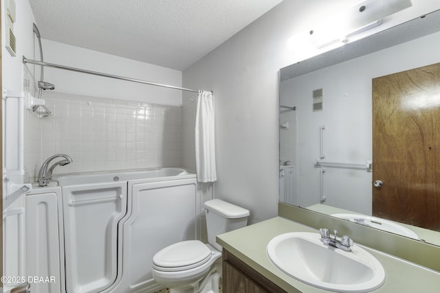 bathroom featuring visible vents, toilet, a textured ceiling, and vanity