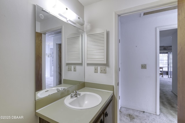 bathroom with baseboards and vanity