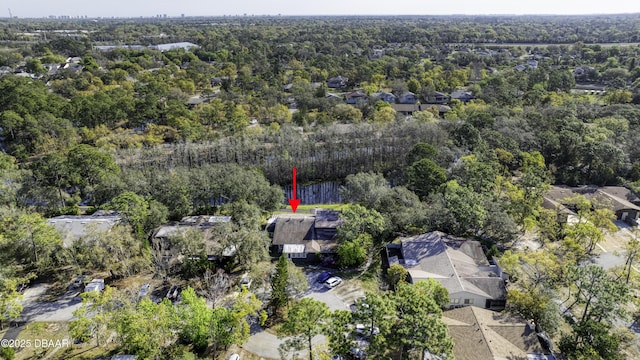 birds eye view of property featuring a residential view and a view of trees