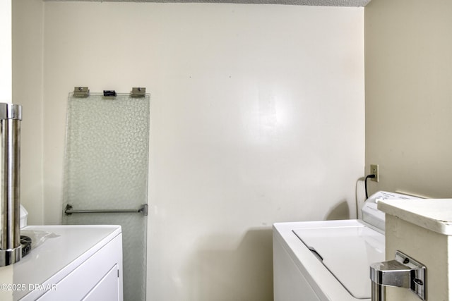 clothes washing area with laundry area and independent washer and dryer