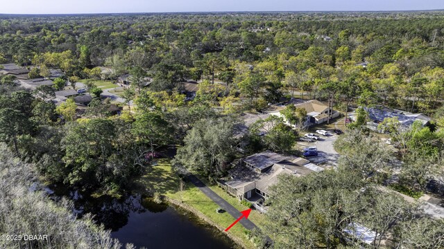 birds eye view of property with a forest view