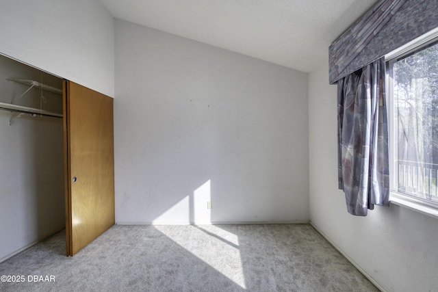 carpeted bedroom with a closet