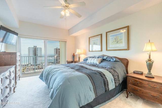 bedroom with access to outside, a ceiling fan, and light carpet