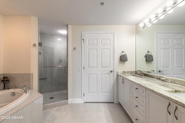 full bathroom featuring double vanity, a stall shower, a bath, and a sink