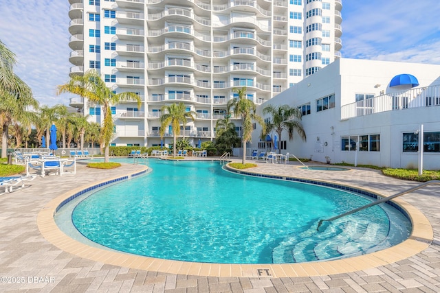 community pool with a patio