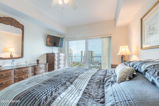 bedroom with access to outside and a ceiling fan