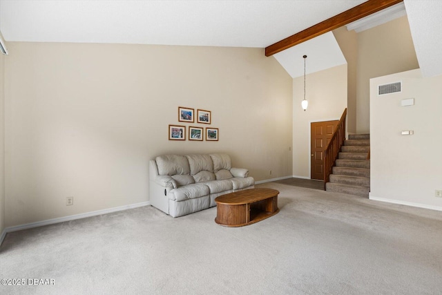 carpeted living room featuring beamed ceiling and high vaulted ceiling