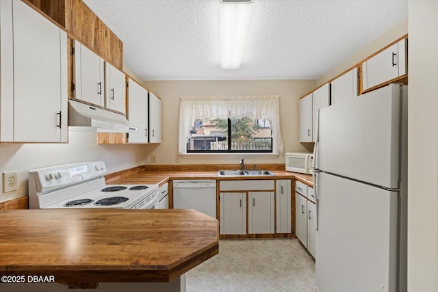 kitchen with white cabinetry, white appliances, sink, and a textured ceiling