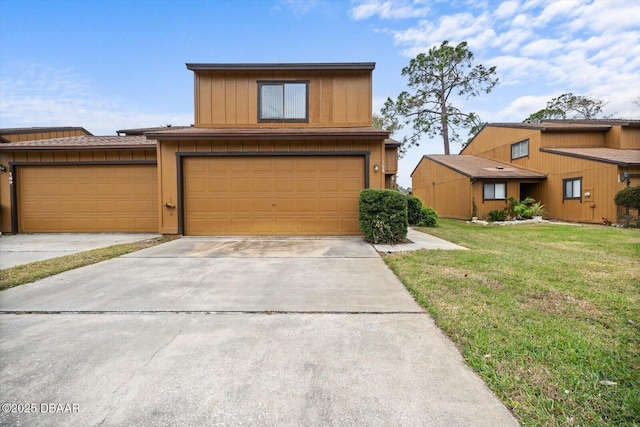 view of front of house featuring a garage and a front lawn