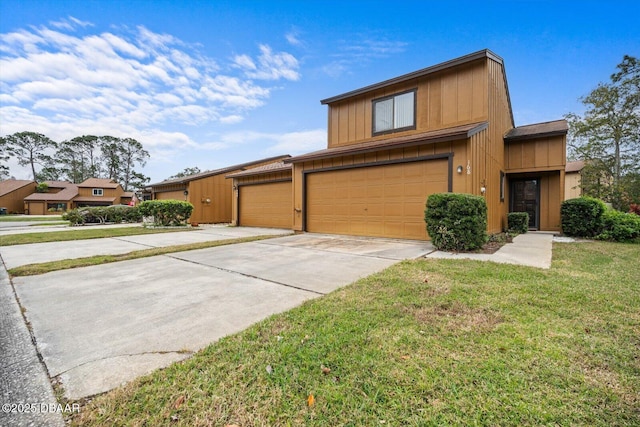 view of front facade featuring a garage and a front lawn