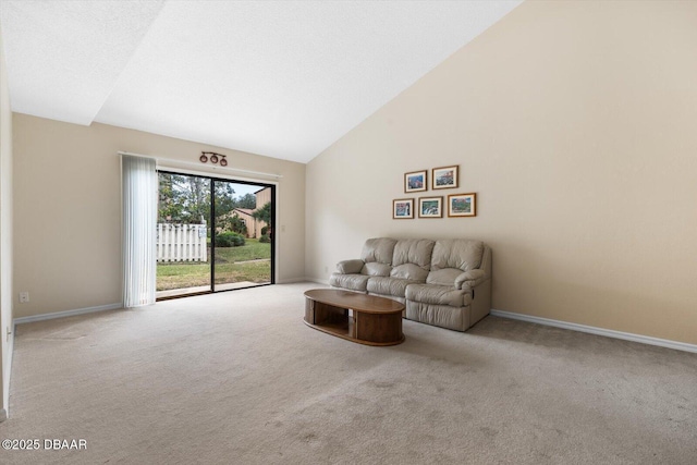 living room featuring high vaulted ceiling and light colored carpet