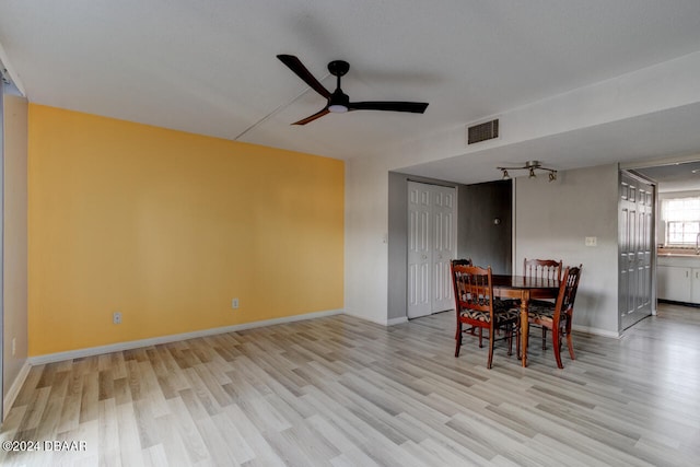 dining room with light wood-type flooring and ceiling fan