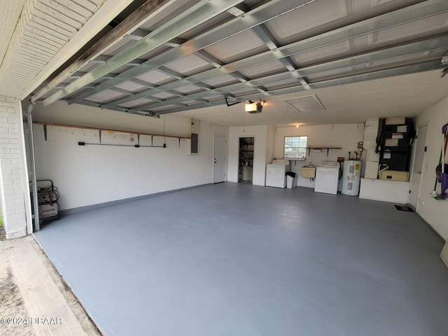 garage featuring electric panel, heating unit, a garage door opener, independent washer and dryer, and electric water heater