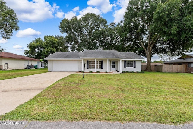 single story home with a front lawn and a garage