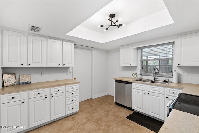 kitchen featuring a chandelier, sink, a raised ceiling, white cabinetry, and appliances with stainless steel finishes