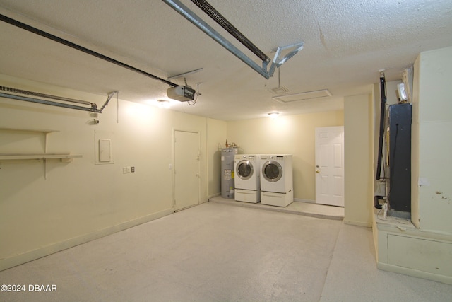 interior space featuring a garage door opener, separate washer and dryer, and water heater