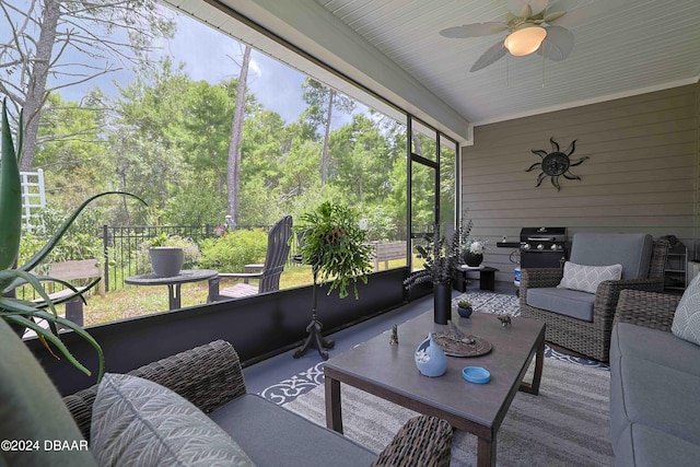 sunroom with wooden ceiling and ceiling fan