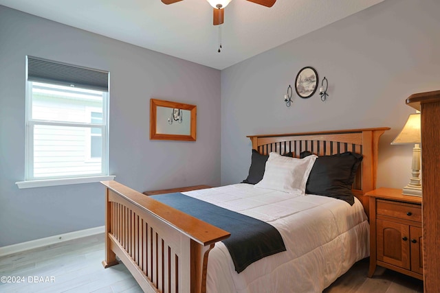 bedroom featuring light wood-type flooring and ceiling fan