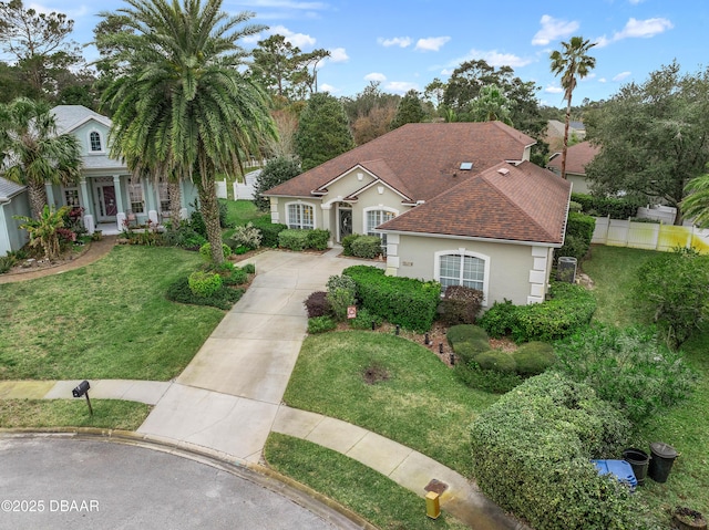 mediterranean / spanish-style house featuring a front lawn