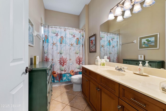 bathroom featuring vanity, toilet, and tile patterned flooring