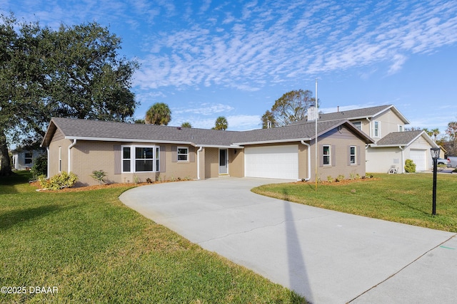 single story home featuring a garage and a front lawn