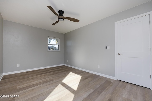 spare room featuring ceiling fan and light hardwood / wood-style flooring