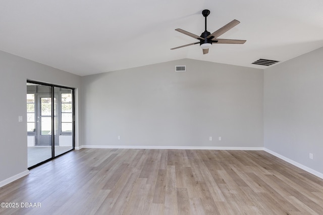 empty room featuring ceiling fan, lofted ceiling, and light hardwood / wood-style floors